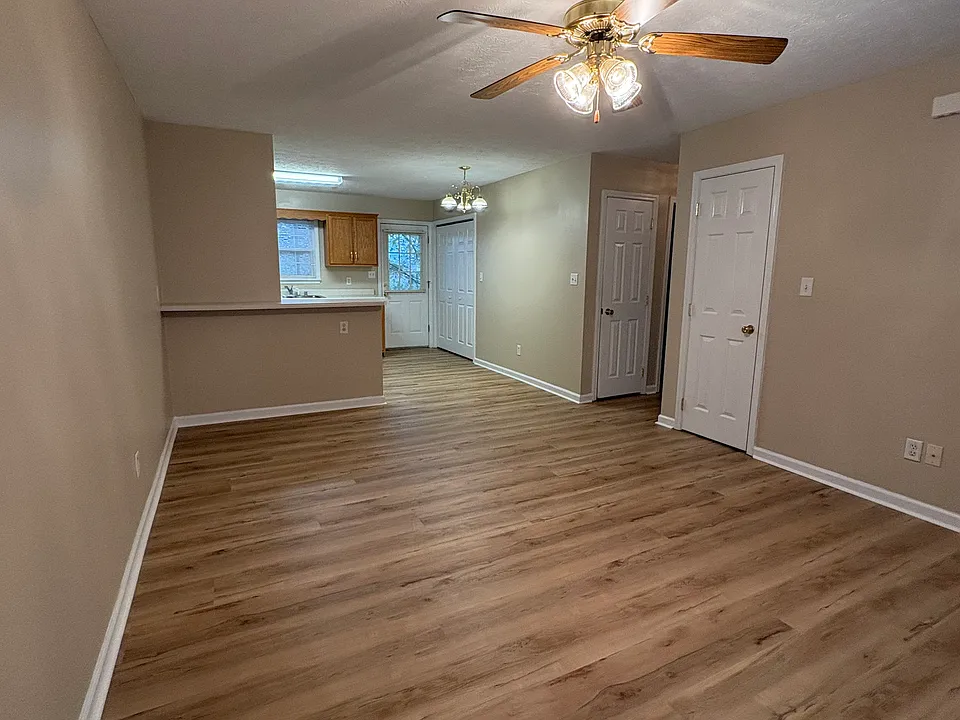 Living room, dining room, kitchen area, new flooring