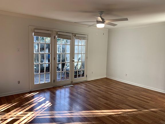 Living Room with french doors to patio and level fenced backyard