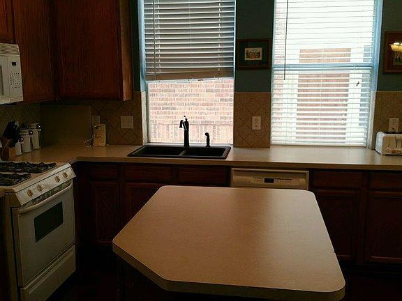 Kitchen with work island and wall of windows