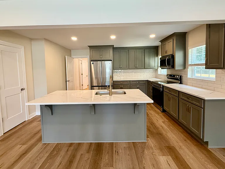 Newly renovated kitchen with brand new SS appliances, new quartz countertops and plenty of new cabinets