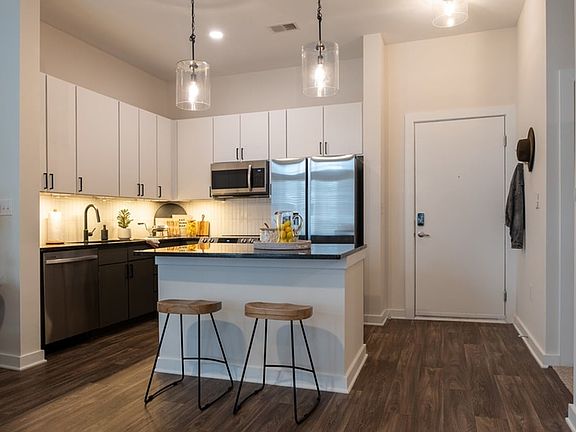 Stainless steel appliances including side-by-side refrigerator