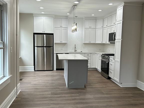 New kitchen with island and space for stools.