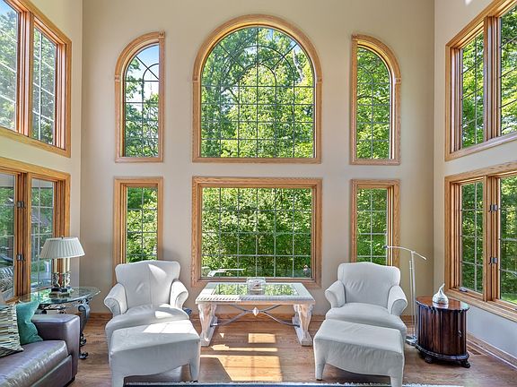 Nothing short of a gorgeous room! Million dollar views of the backyard and forest, two sided Firepla