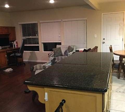 Partial view of the living room and kitchen island