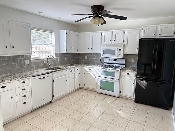 Large modern kitchen with granite counters