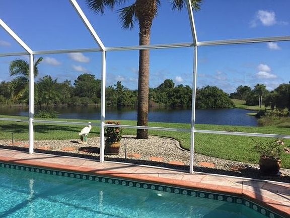 view of pond and golf course