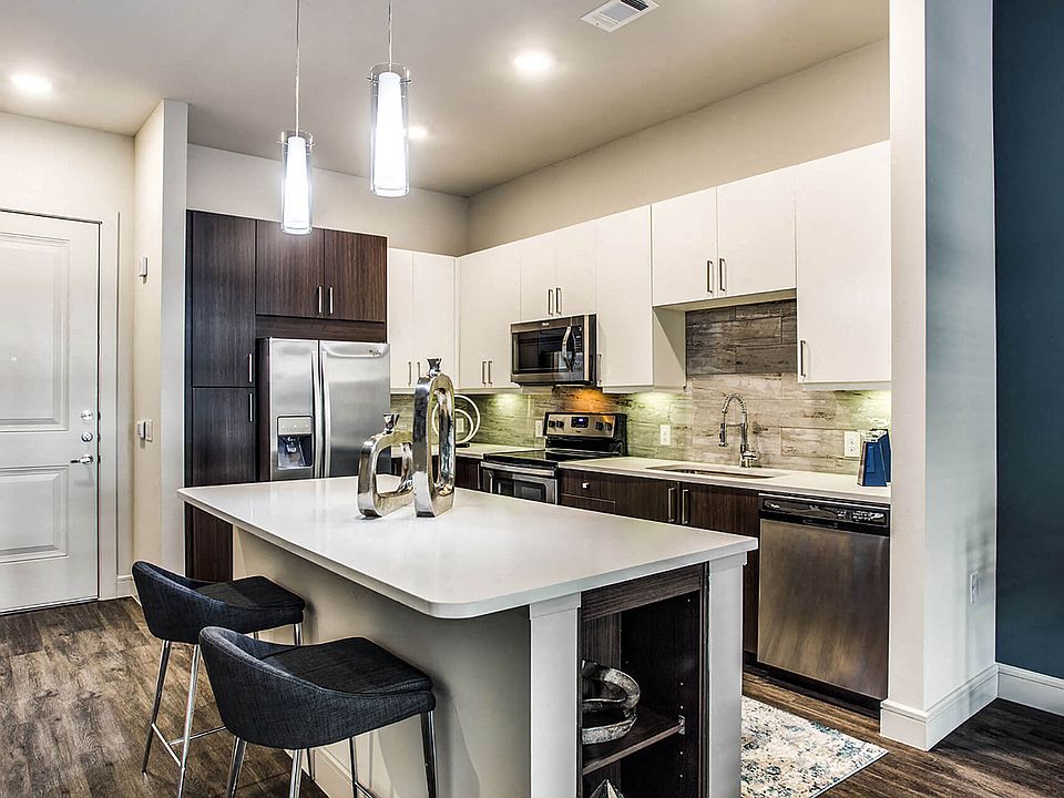 Coveted finishes including quartz countertops, tile backsplashes and upgraded fixtures