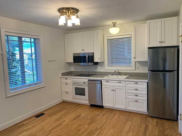 Fully equipped kitchen with stainless steel appliances. Separate pantry off hallway.