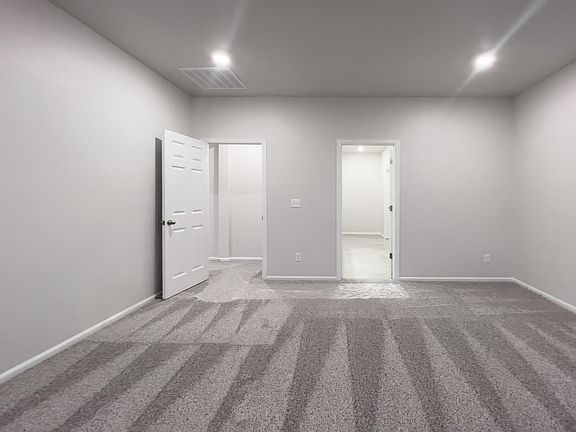 A primary bedroom perfect for unwinding after a long day.