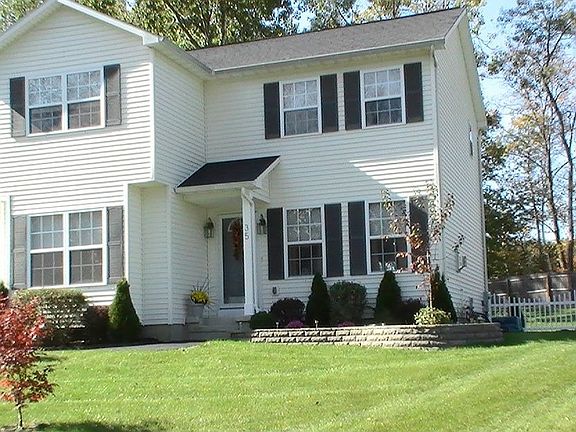 Front with landscape wall