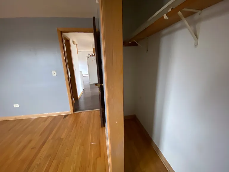 3 West first bedroom closet. The closet is oversized and runs the length of the bedroom.