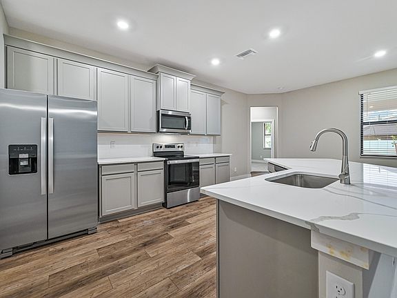 This kitchen is chef-ready with brand-new stainless steel appliances
