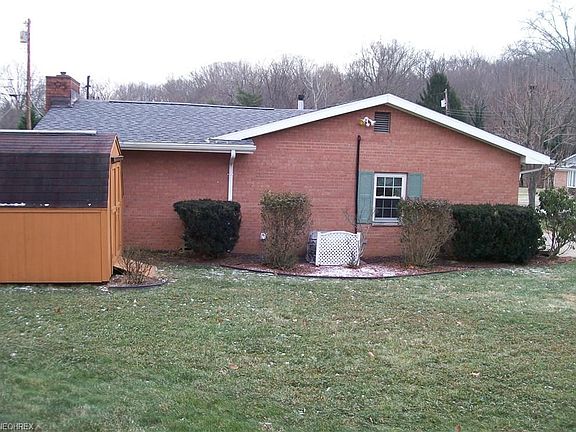Side view of house and storage building.