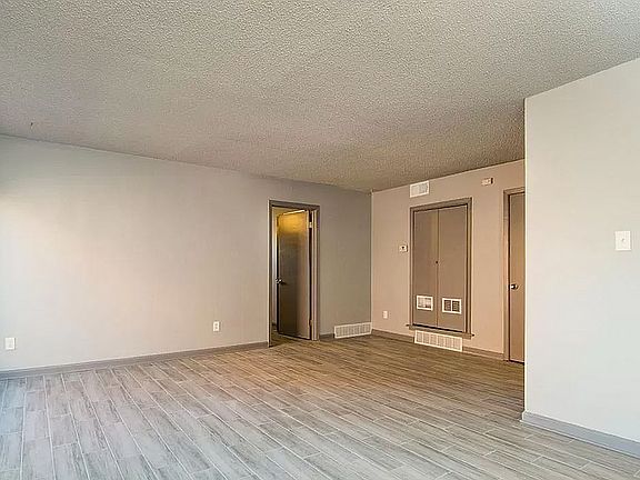 Experience the spaciousness of this modern living room, perfect for relaxation and entertaining.