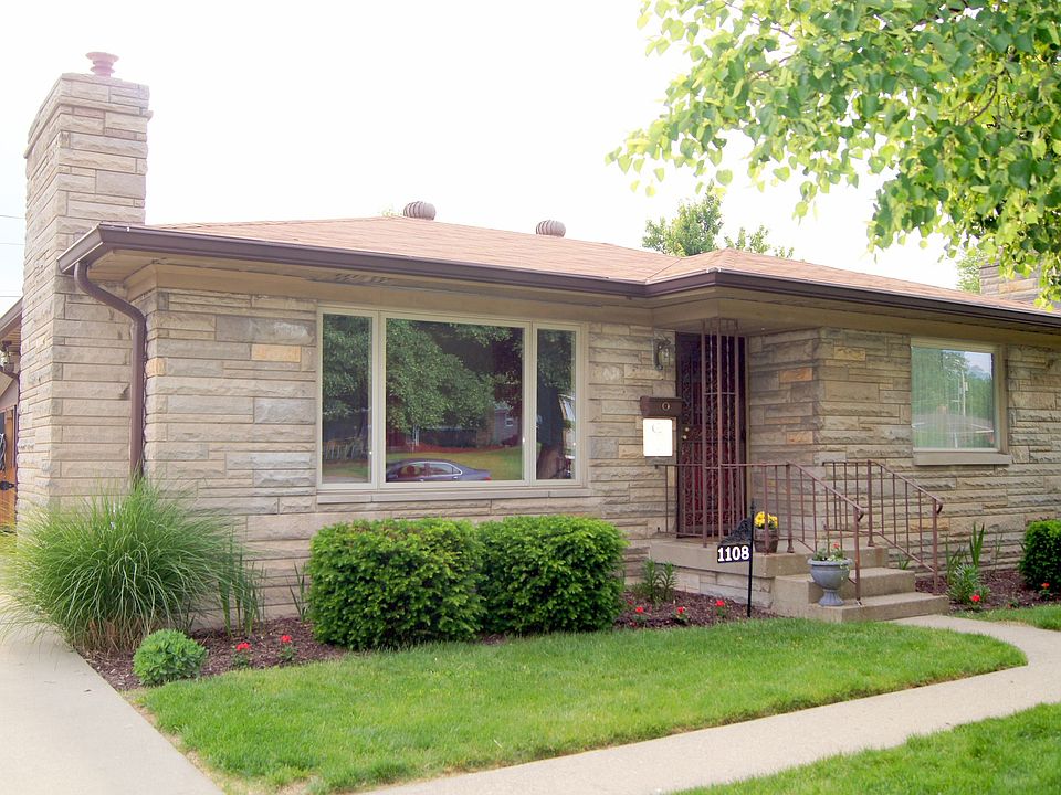 Beautiful Indiana Limestone home.  Newer 50yr roof, gutters and gutter guards.