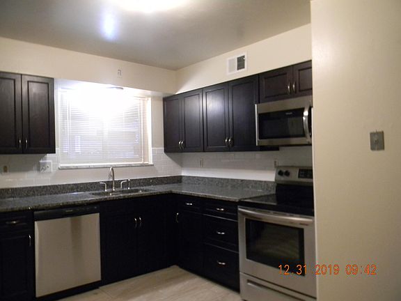 kitchen Granite countertops. There is stainless appliances, dishwasher ,stove, refrigerator