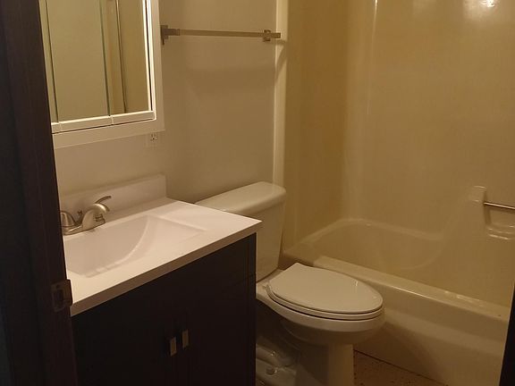Updated bathroom with Tub/shower. Lighted mirror has storage.