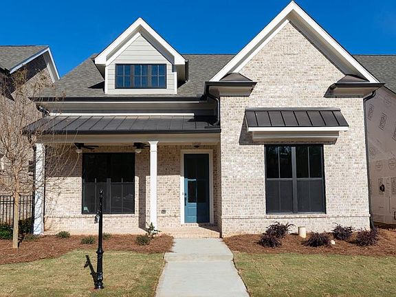 All brick front will be Farm House WHITE Not actual home. Photo of previously built Hampton II flo