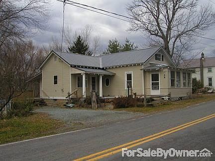 Approach to House on Doig St.
						:
						This is the side with the bulk of the land, which totals .98 acres.
