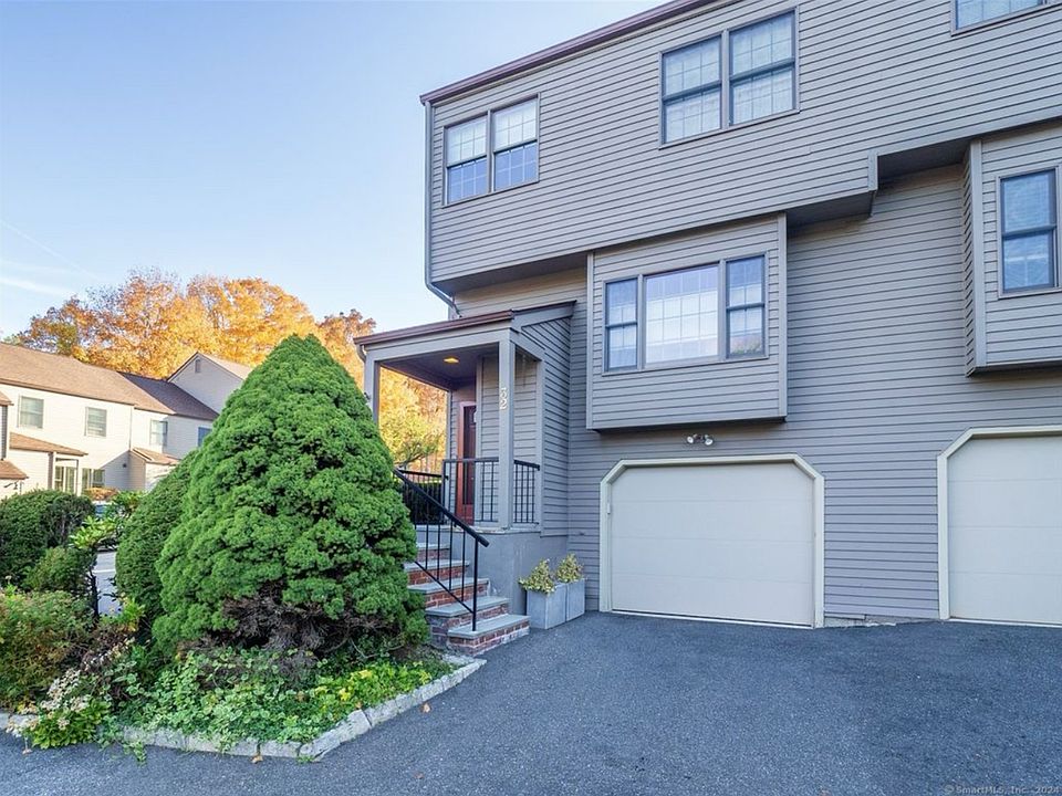 Exterior View: Main Entrance + Garage