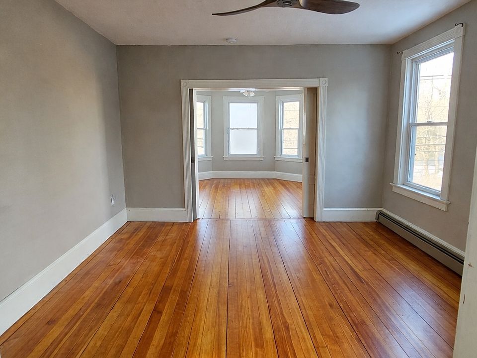 living room/dining room space w/ pocket door for privacy.