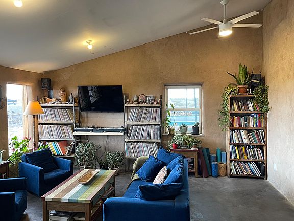 Living area with books, records, TV.