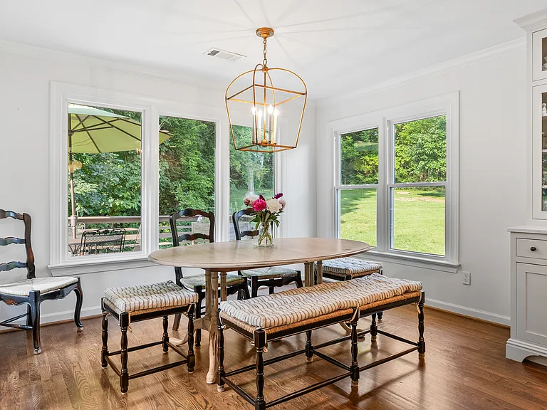 Lots of natural light in the dining room located off the kitchen with seating for 8.