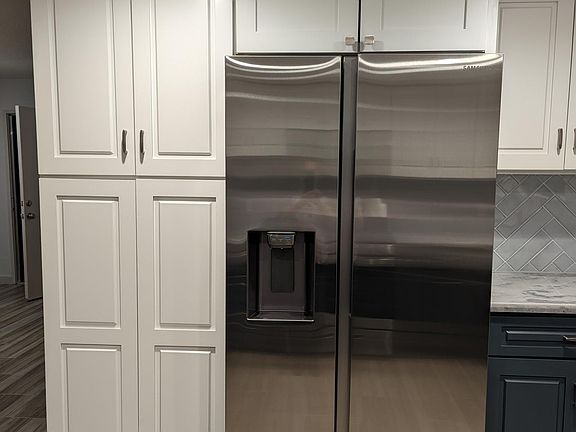 New refrigerator with ice maker and water dispenser in door