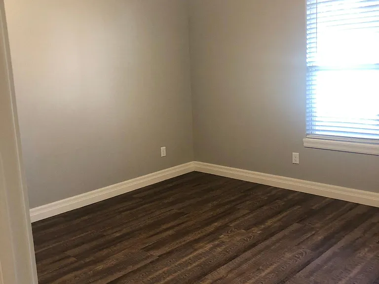 Master bedroom with back door to patio