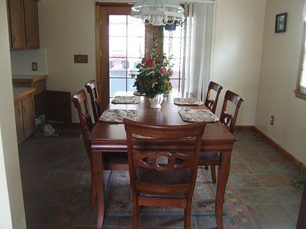 Dining room with patio door opening to hot tub