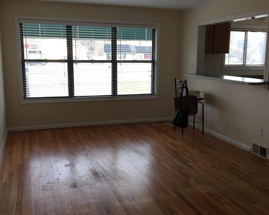 Living room, wood blinds, pass thru to kitchen.