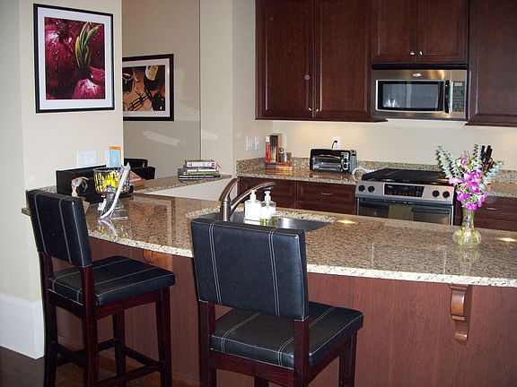 kit,ss.grainite,cherry stained cabinets