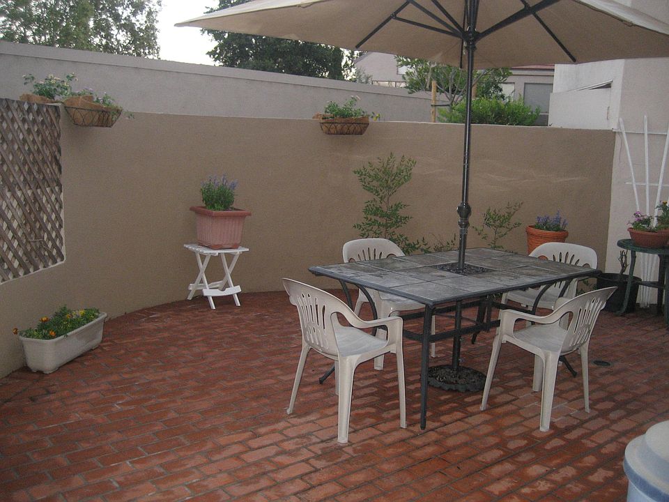 Huge enclosed patio with fresh landscaping