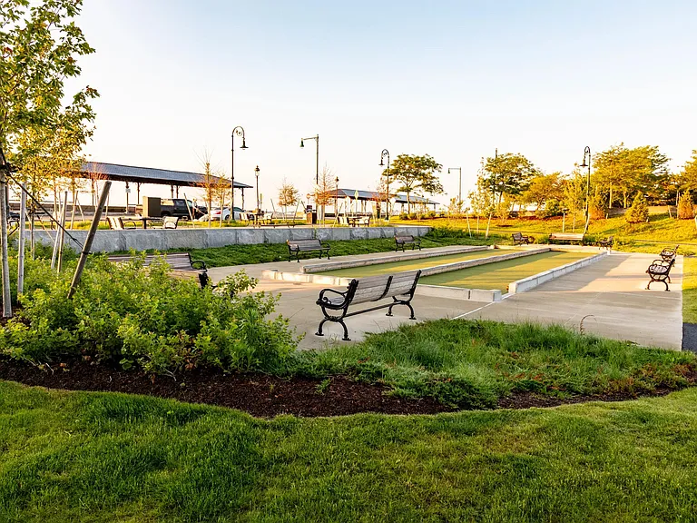 Gather with neighbors for a game of bocce or relax on a shaded bench in the scenic waterfront green space minutes from your door.
