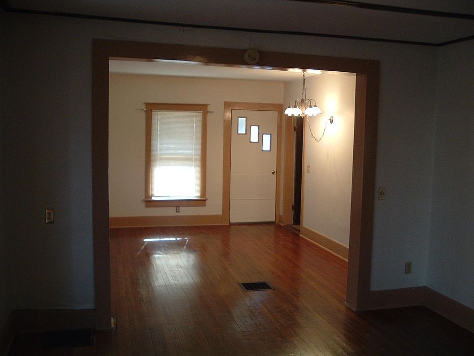 Living/Dinning room from the opposite end. Front Entry door.