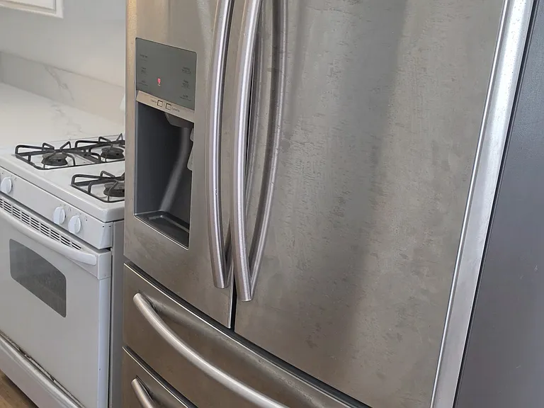 French door style newer refrigerator/freezer
