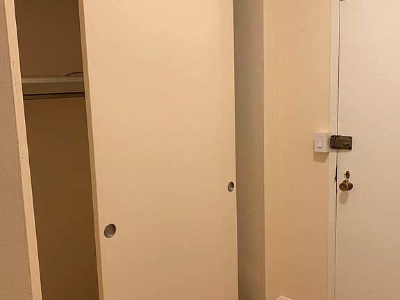 Front hallway with coat closet.