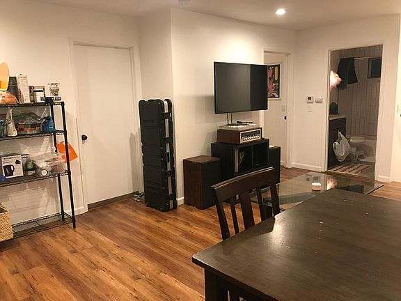 2 bedrooms off of upstairs living room, 1 of 3 full baths off of living room