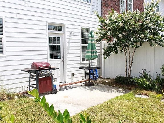 Private fenced-in backyard for grilling and parties