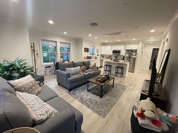 Kitchen with island overlooking living room