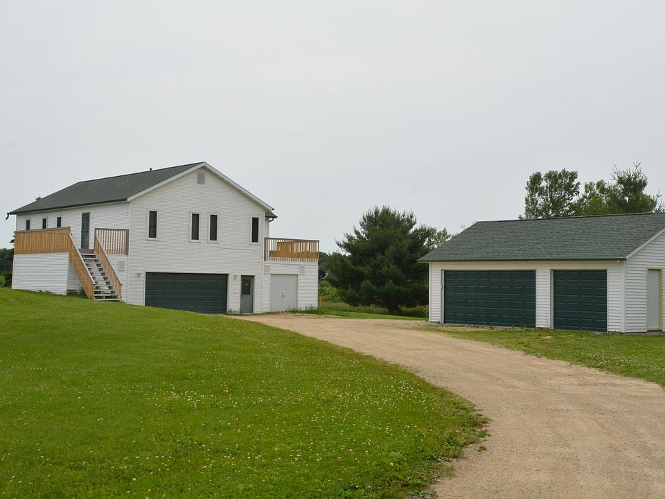 2 acres to be mowed by tenant and snow removed from driveway. 2 car attached garage and 2 car detached garage for tenant with one stall reserved for landlord.