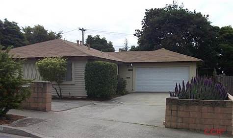 Front view of this single level 3 bedroom 2 bath home which shows the additional parking area.  This home also features a large, private fenced yard and engineered wood floors.