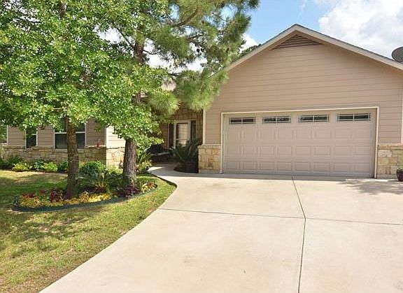 Concrete drive keeps the garage clean and inclement weather so much easier to manage