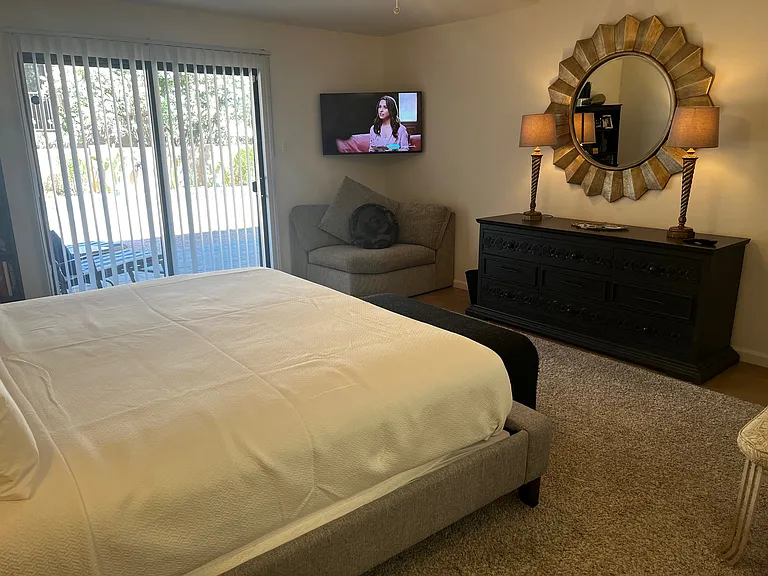 Master Bedroom with Privat tv, and slider leading to oversized patio