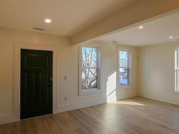 Efficiency living room space with wall mount TV outlet.