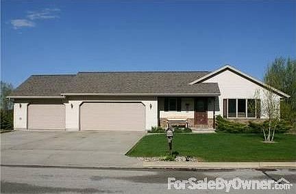 front of house outside
						:
						Beautifully landscaped easy to care for yard. Flowers grow around the home.