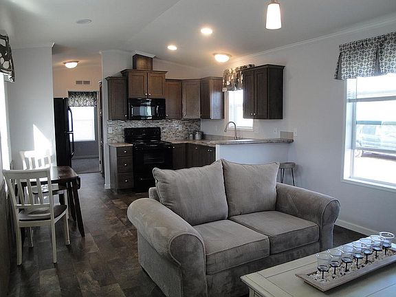 Black appliances included. Electric range, microwave, refrigerator, dishwasher, garbage disposal.