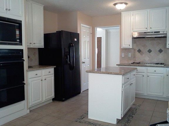 new granite countertops,tile blacksplash,brand new refridgerator