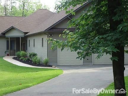 LOCATION! LOCATION! LOCATION! : Built in 2007 custom built ranch is nestled on wooded lot 1 mi. from