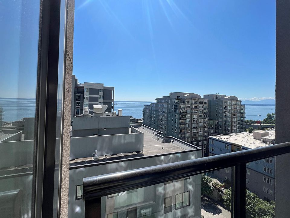Balcony with a view of Alki, Sculpture Park, and Olympic Mountain Range